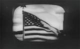 Првата ТВ слика пренесена  преку Телстар 1, знамето пред земската станица во Андовер, САД 