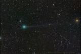Кометата Нишимура, со зелена кома и тенка опашка, снимена од Јунското Езеро, Калифорнија, САД.